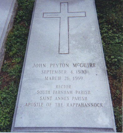 Picture of John Peyton McGuire&rsquo;s grave with cross at top.